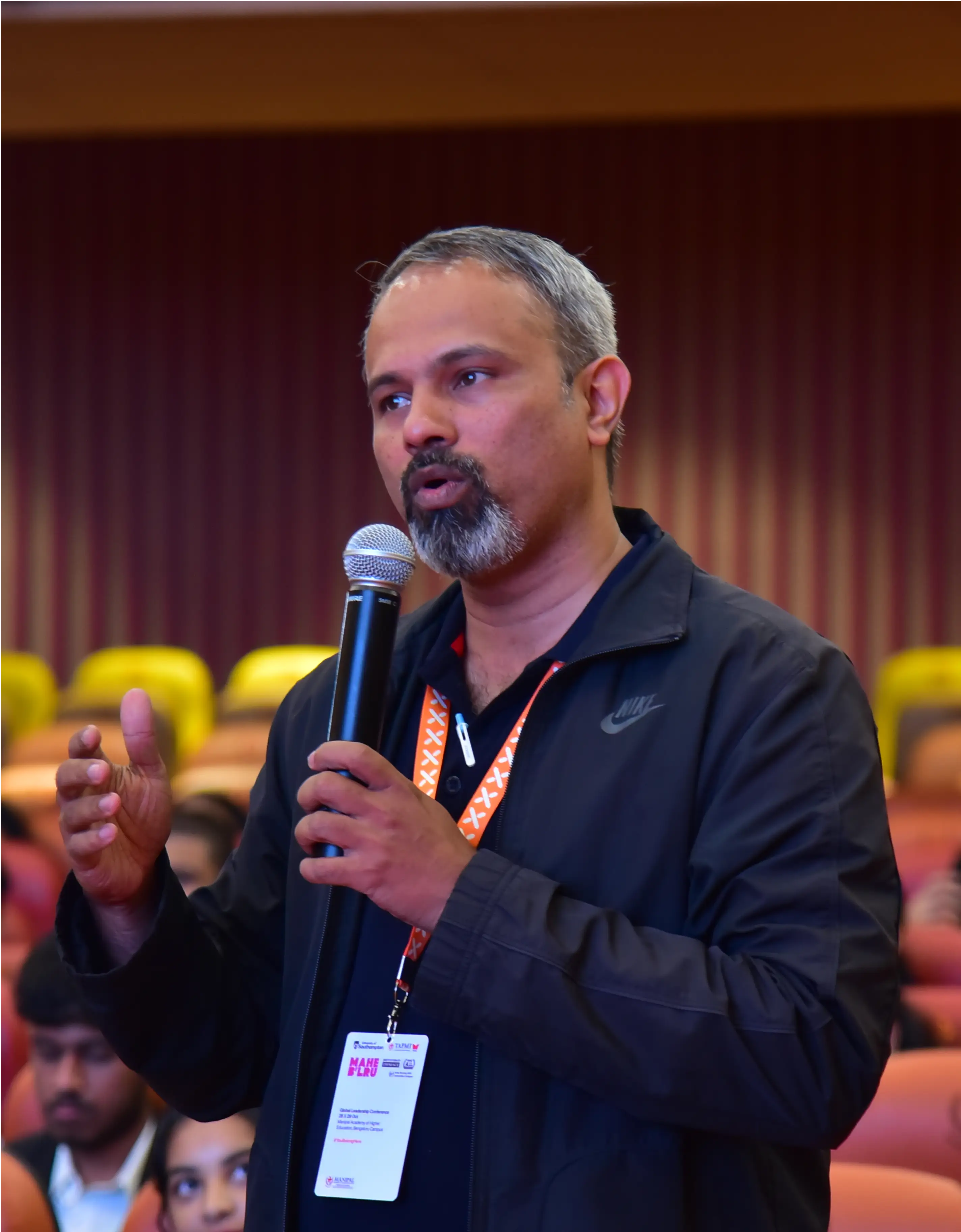 GLC Delegate speaking during live colloquium deliberations at MAHE Bengaluru
